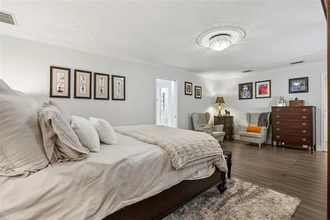 a bathroom with a granite countertop sink mirror and shower