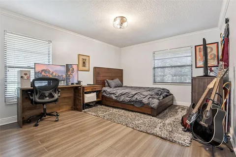 a bed room with a bed and a couch