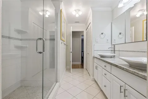 a living room with furniture a chandelier and a rug