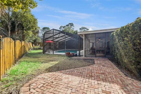 a view of outdoor space with seating area and trees around