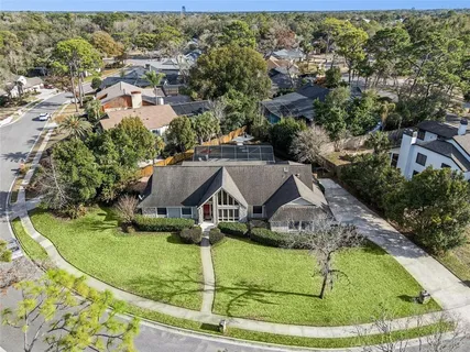 an aerial view of a house with a swimming pool