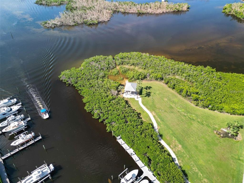 13113 Gasparilla Road, Unit 403 Placida, FL 33946 - Photo 60 of 62 a view of a lake with a yard