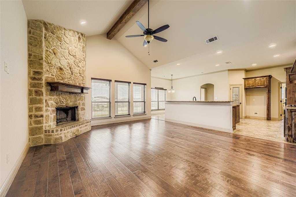 a view of a kitchen with a sink and a fireplace