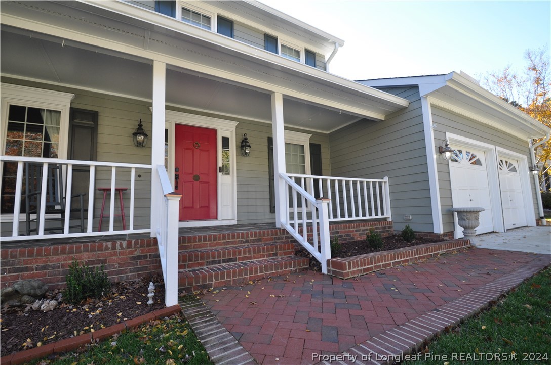 Undisclosed Address Cary, NC 27513 - Photo 2 of 50 a view of a house with a small yard and wooden floor and fence