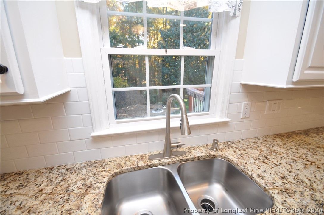 Undisclosed Address Cary, NC 27513 - Photo 21 of 50 a bathroom with a sink and a window