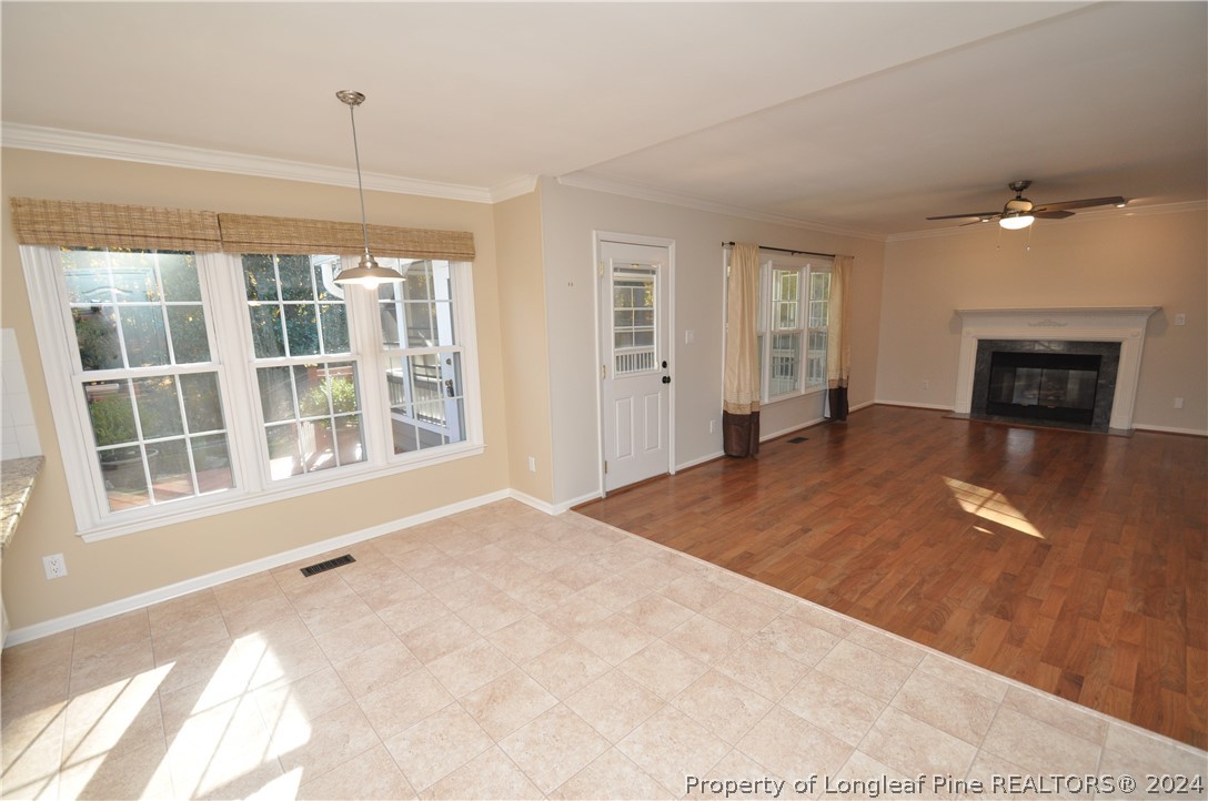 Undisclosed Address Cary, NC 27513 - Photo 25 of 50 a view of an empty room with a window and fireplace