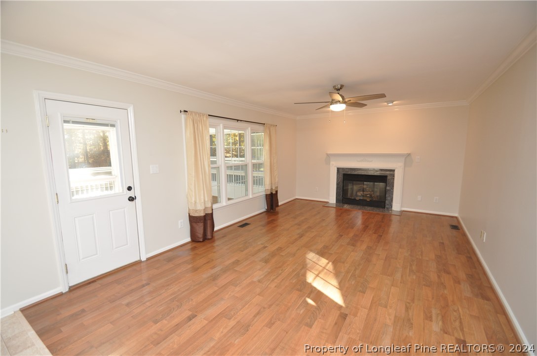 Undisclosed Address Cary, NC 27513 - Photo 28 of 50 an empty room with windows and a fireplace