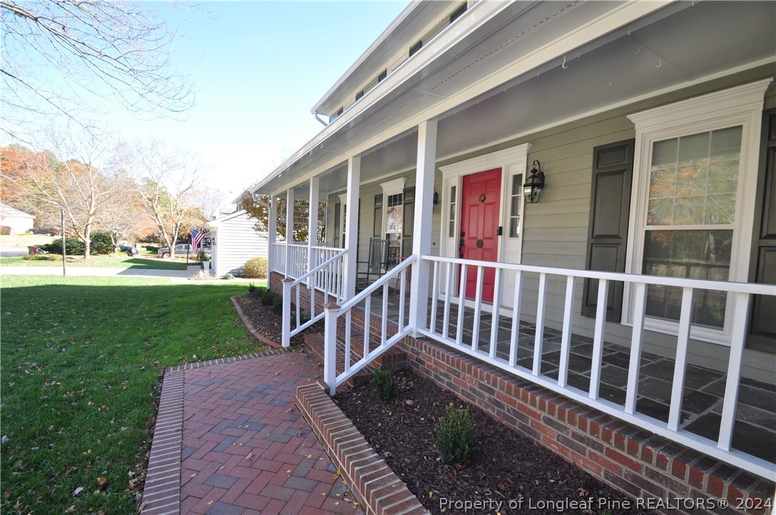 Undisclosed Address Cary, NC 27513 - Photo 3 of 50 a view of a house with a yard