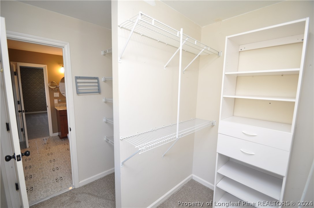 Undisclosed Address Cary, NC 27513 - Photo 40 of 50 a view of an empty walk in closet