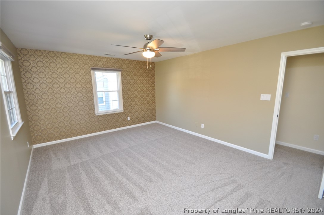 Undisclosed Address Cary, NC 27513 - Photo 41 of 50 a view of an empty room with a window