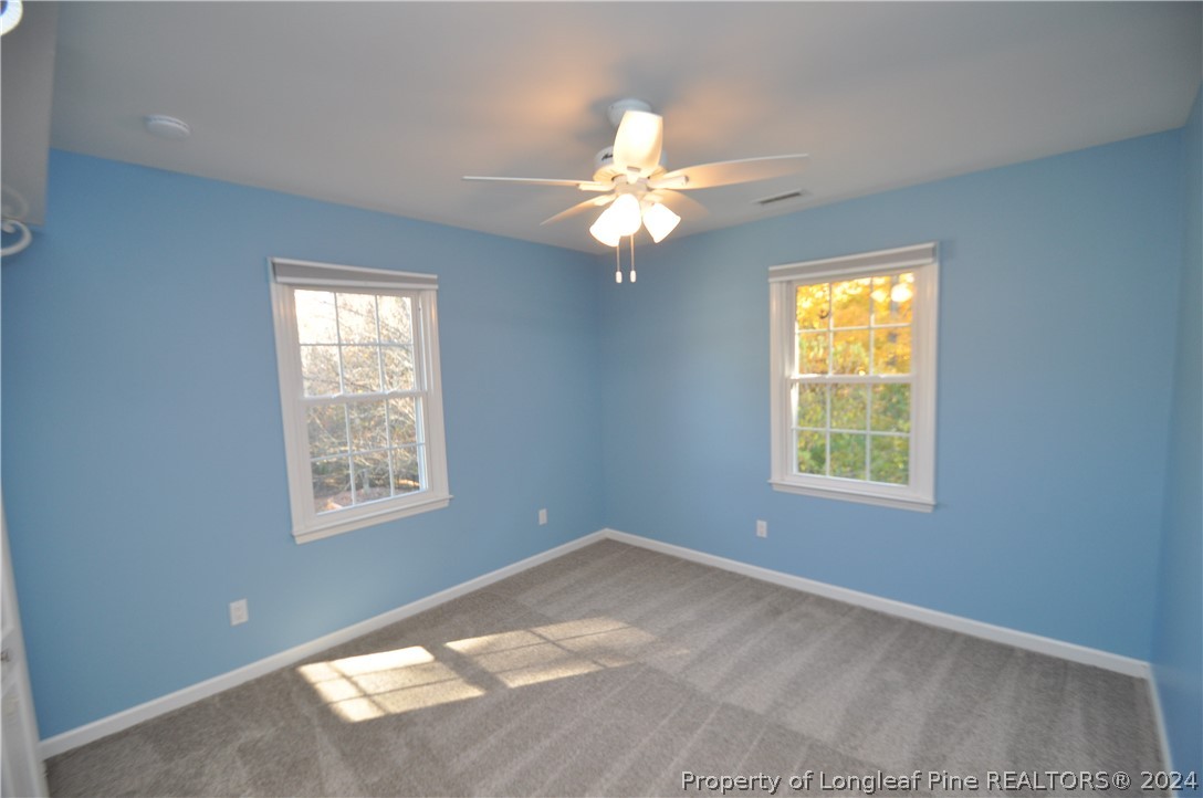 Undisclosed Address Cary, NC 27513 - Photo 42 of 50 a view of an empty room with a window