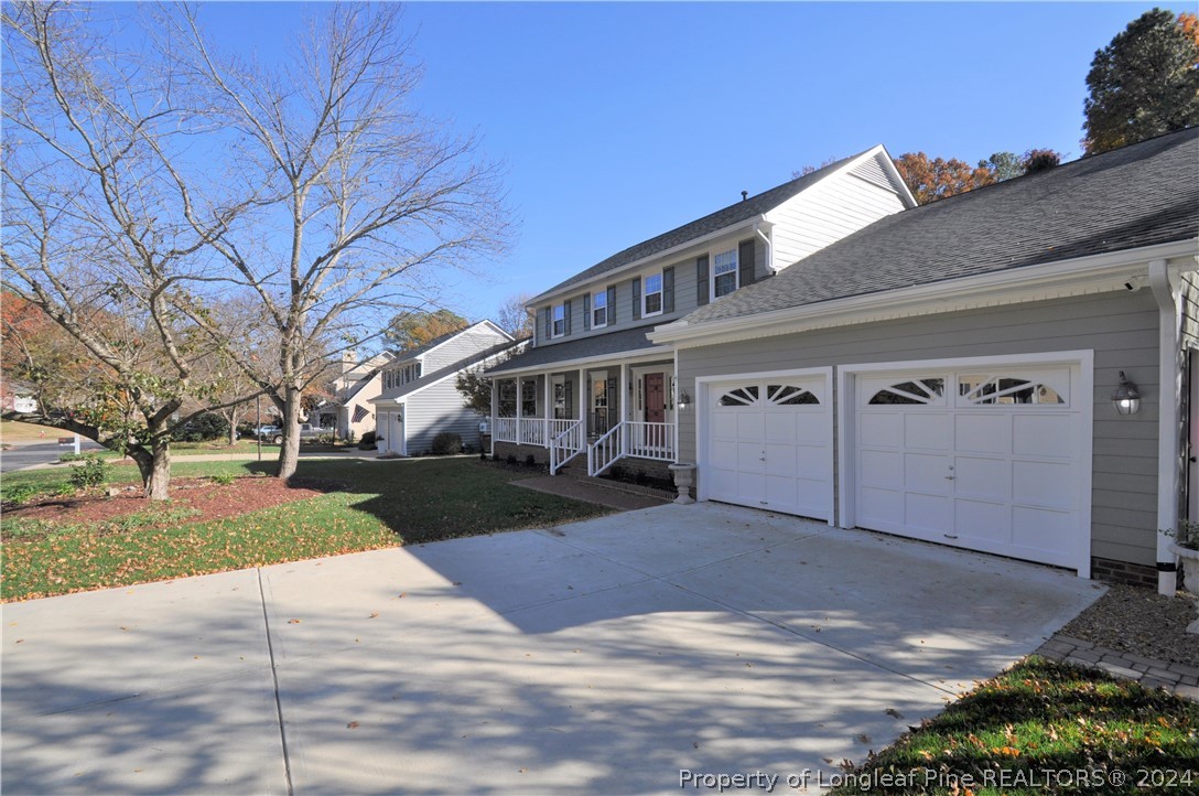 Undisclosed Address Cary, NC 27513 - Photo 5 of 50 a view of a house with a yard
