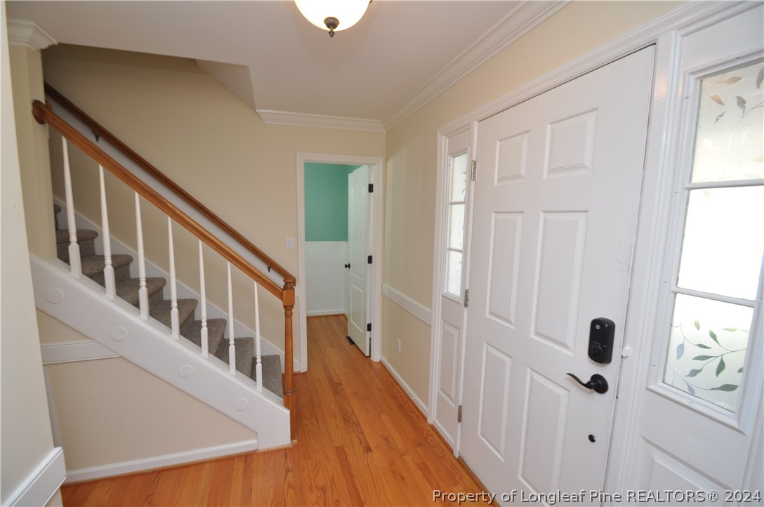 Undisclosed Address Cary, NC 27513 - Photo 7 of 50 a view of an entryway with wooden floor
