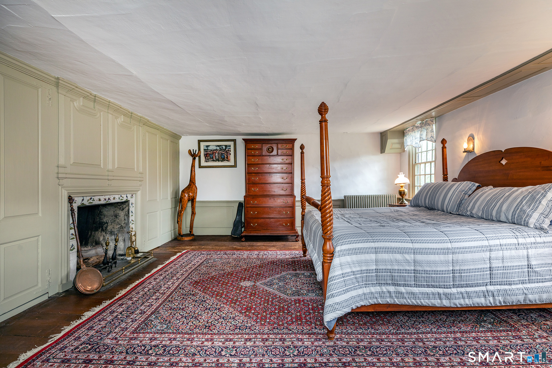30 Hollow Road Woodbury, CT 06798 - Photo 23 of 40 a bedroom with a bed and a fireplace