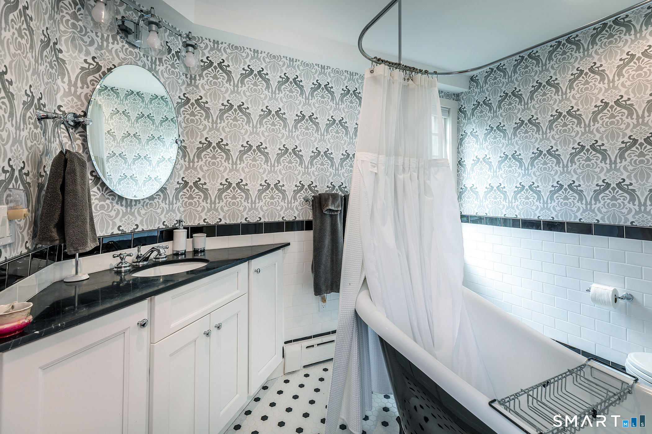 30 Hollow Road Woodbury, CT 06798 - Photo 27 of 40 a bathroom with a granite countertop sink a mirror and shower