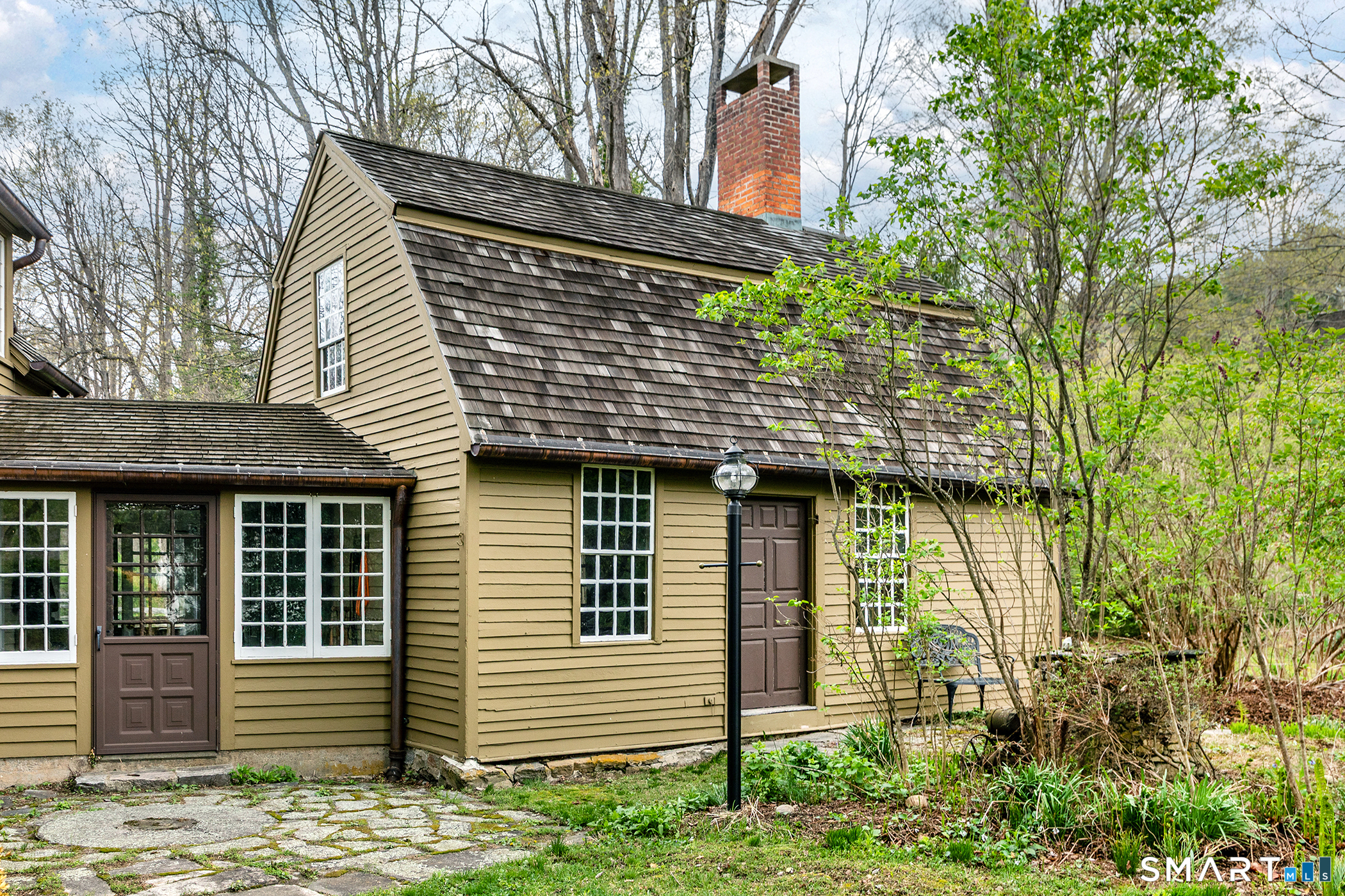 30 Hollow Road Woodbury, CT 06798 - Photo 35 of 40 a front view of a house with a garden