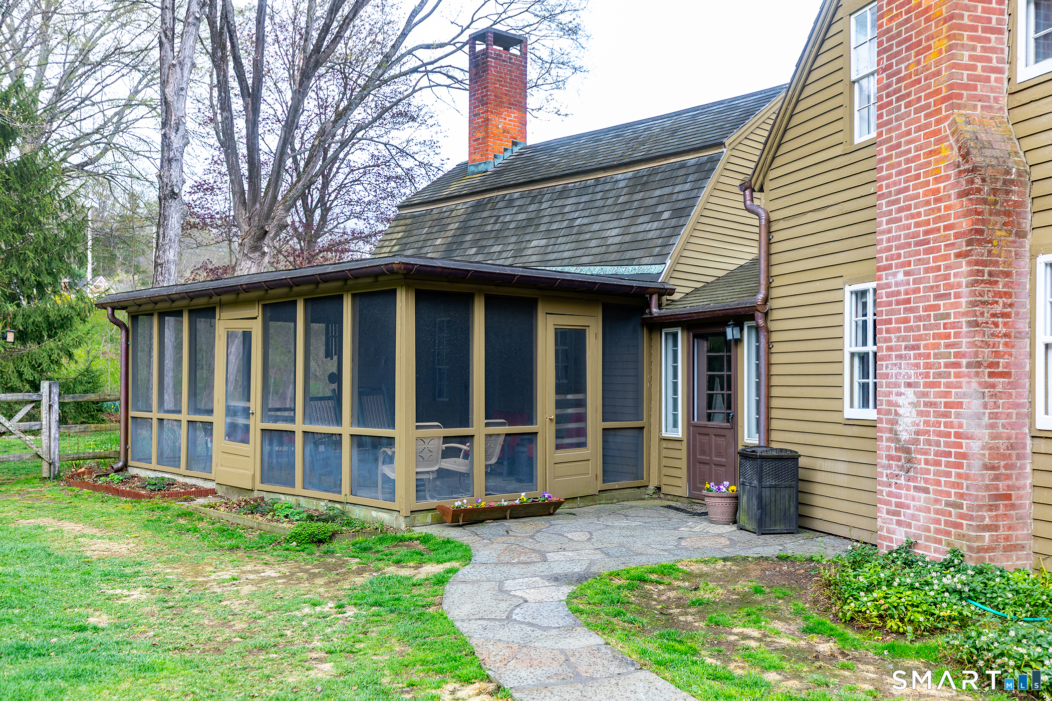 30 Hollow Road Woodbury, CT 06798 - Photo 36 of 40 a view of a house with a yard and plants