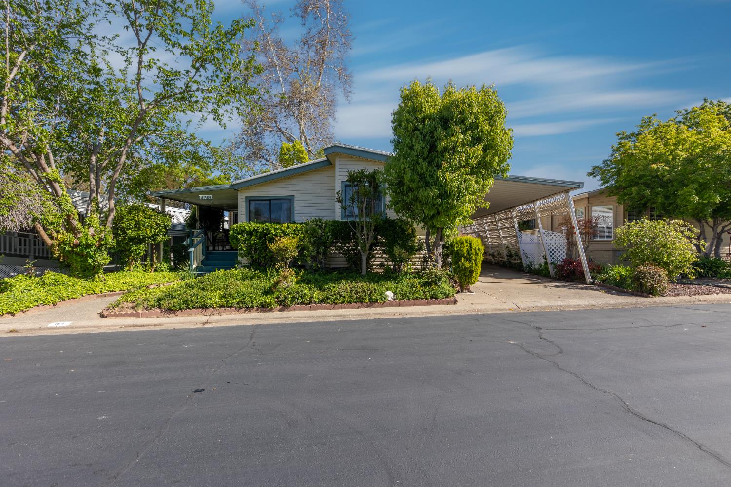 front view of a house next to a road
