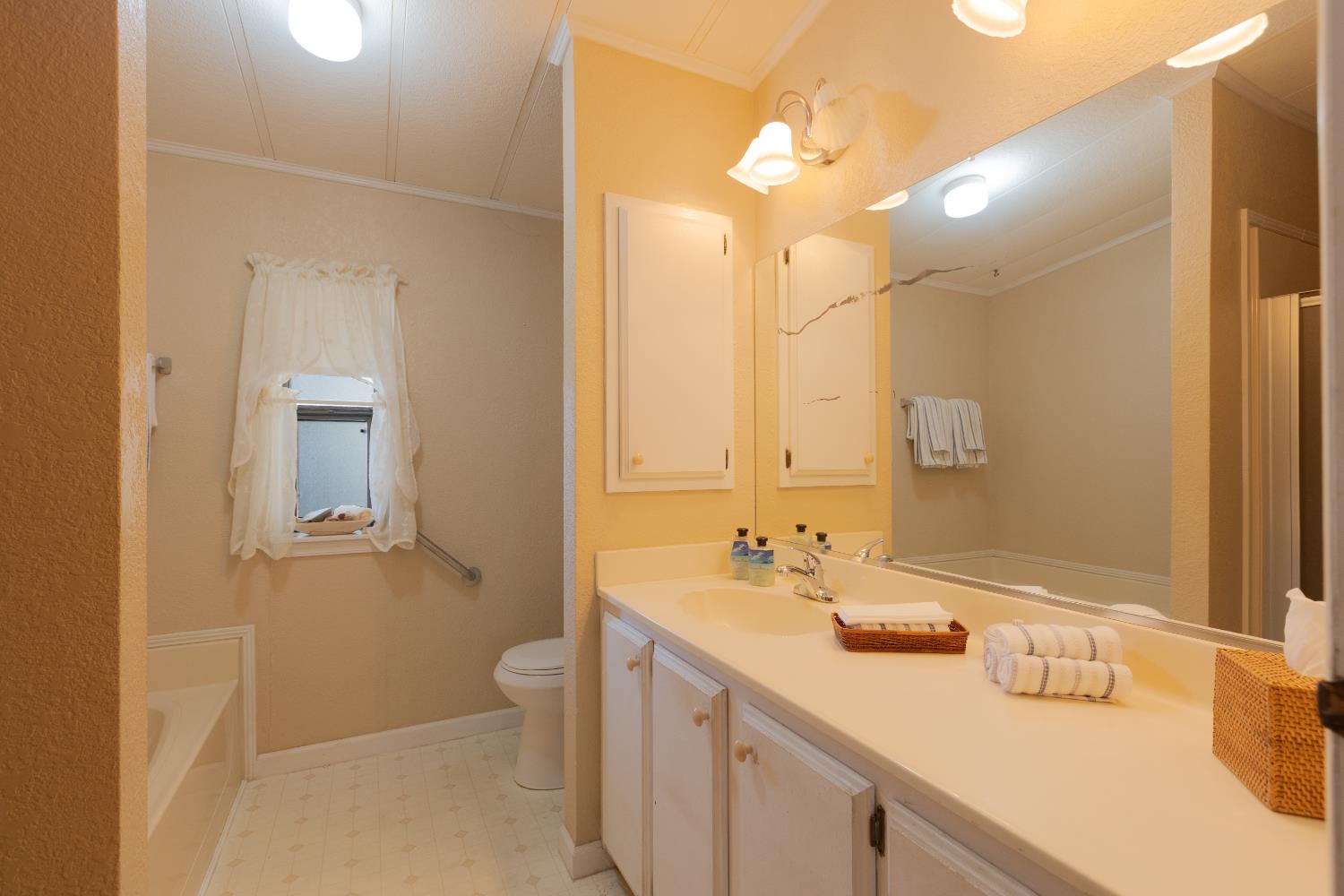 14789 Jurata Court Rancho Murieta, CA 95683 - Photo 11 of 36 a bathroom with a sink a toilet and shower