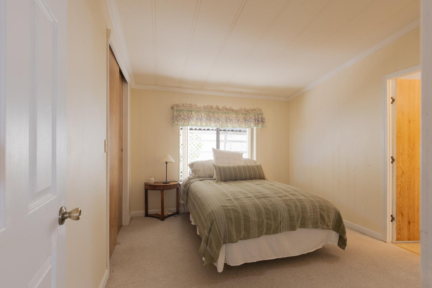 14789 Jurata Court Rancho Murieta, CA 95683 - Photo 12 of 36 a bedroom with a bed and window