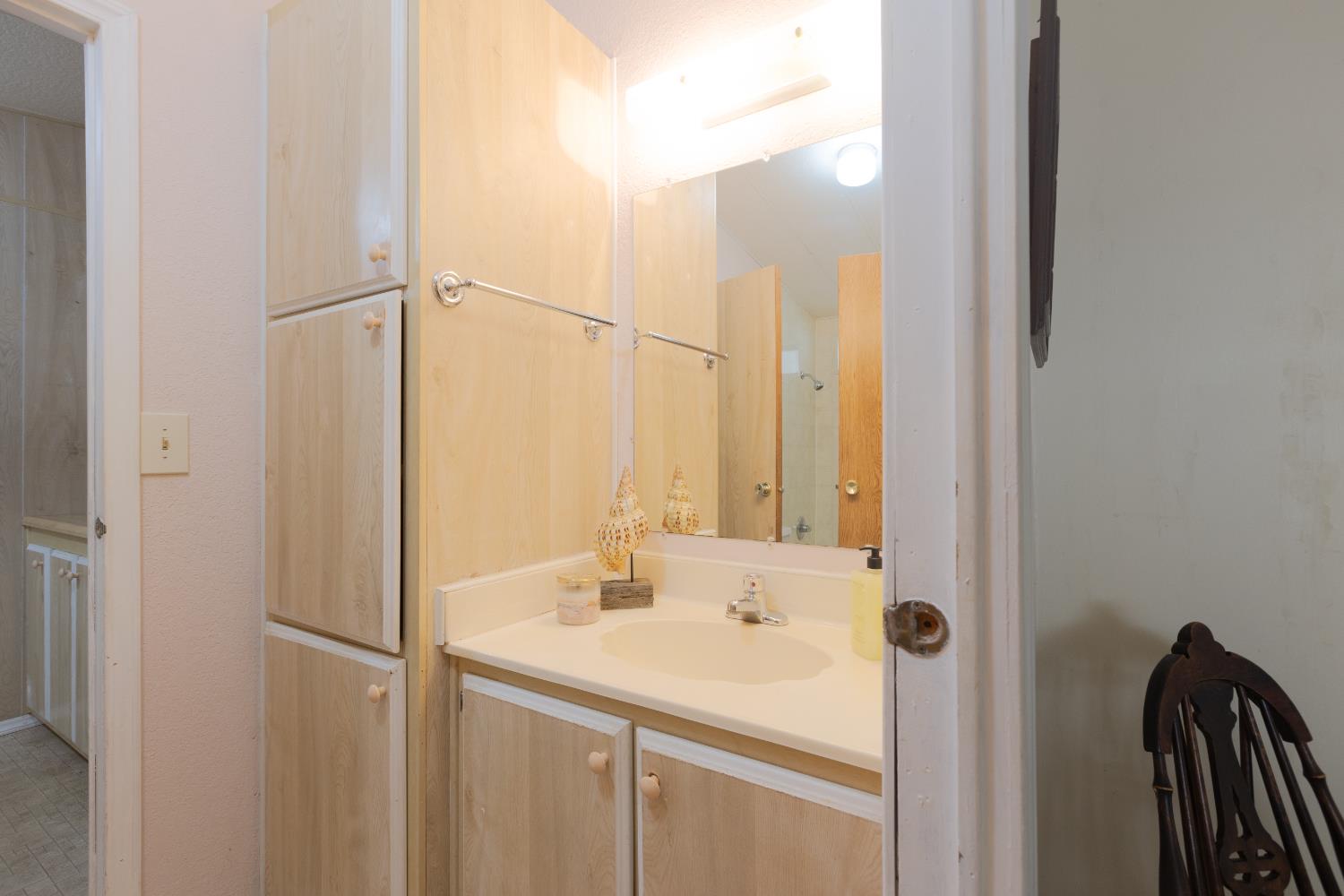 14789 Jurata Court Rancho Murieta, CA 95683 - Photo 13 of 36 a bathroom with a sink and a mirror