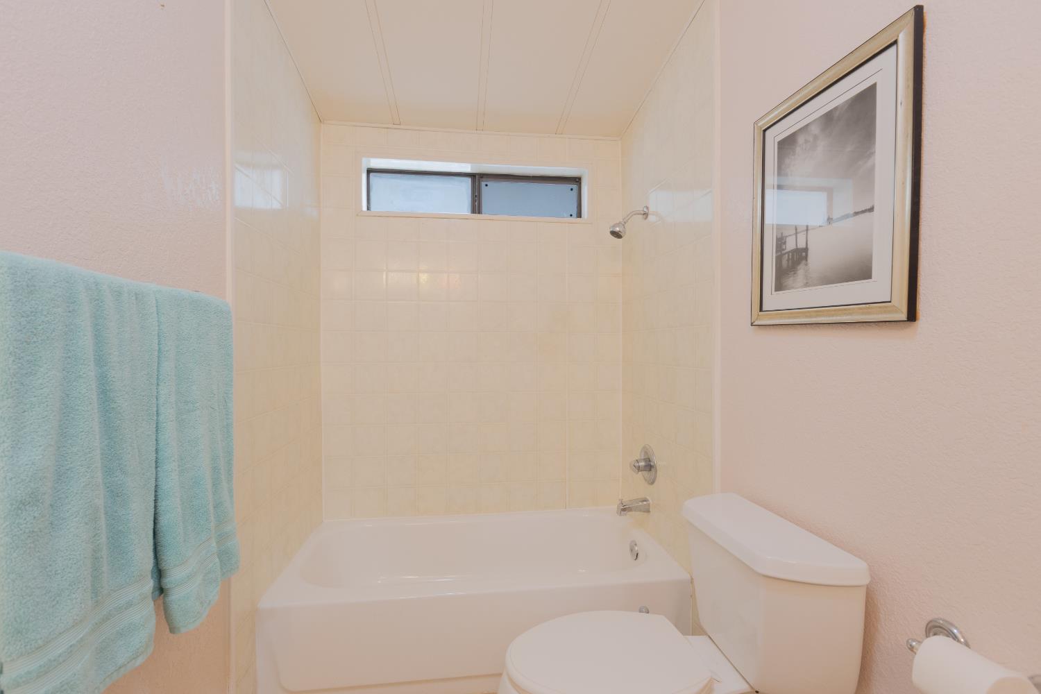 14789 Jurata Court Rancho Murieta, CA 95683 - Photo 14 of 36 a white toilet sitting next to a bath tub