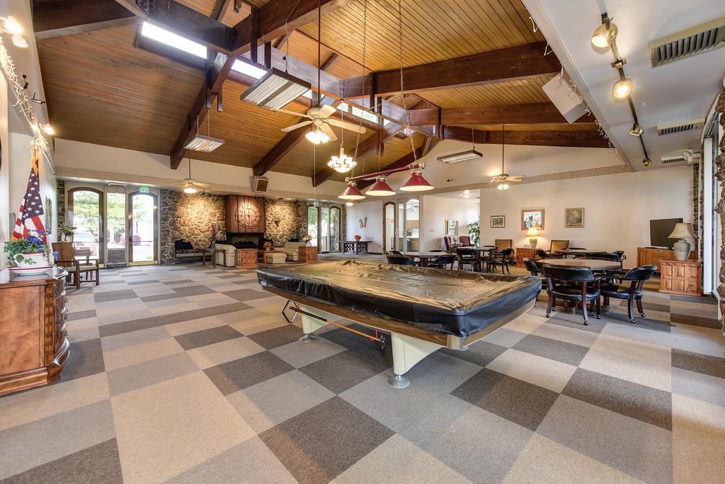 14789 Jurata Court Rancho Murieta, CA 95683 - Photo 21 of 36 a room with lots of tables and chairs