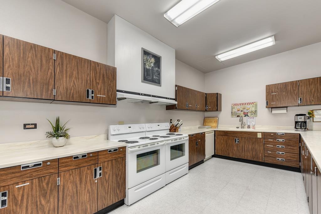 14789 Jurata Court Rancho Murieta, CA 95683 - Photo 26 of 36 a kitchen with stainless steel appliances a stove a sink and a microwave