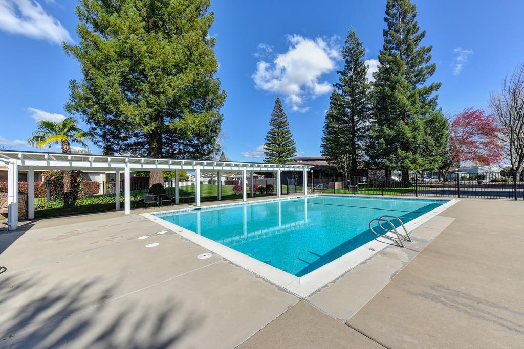 14789 Jurata Court Rancho Murieta, CA 95683 - Photo 30 of 36 a view of a swimming pool with a yard
