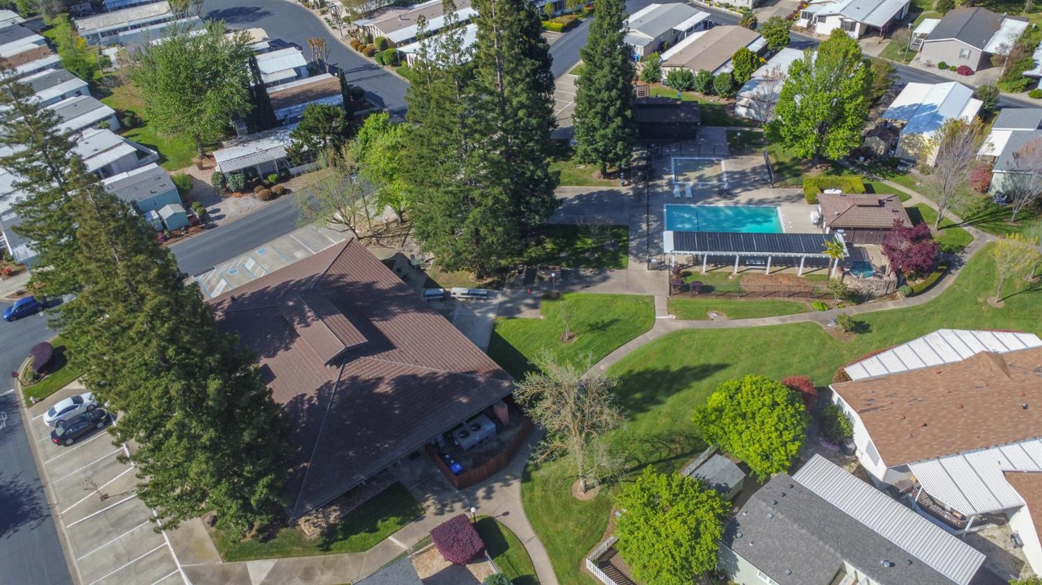 14789 Jurata Court Rancho Murieta, CA 95683 - Photo 3 of 36 an aerial view of a house with a garden and lake view