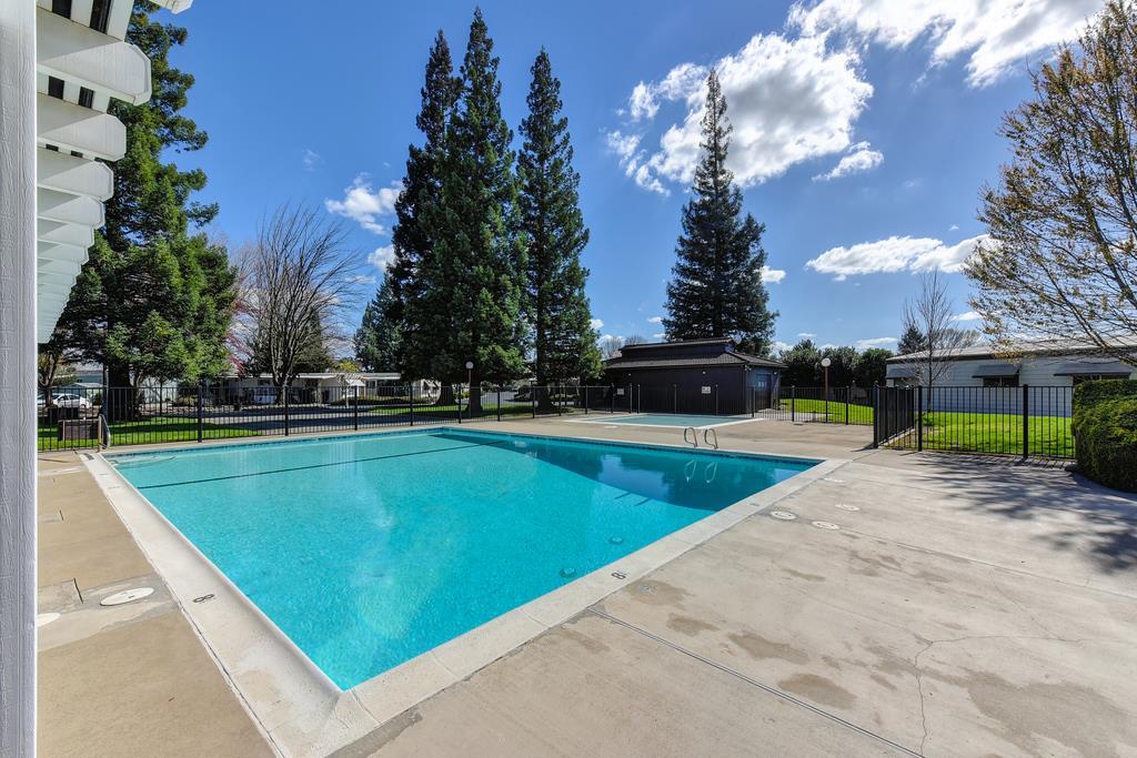 14789 Jurata Court Rancho Murieta, CA 95683 - Photo 32 of 36 a view of swimming pool with outdoor seating and plants