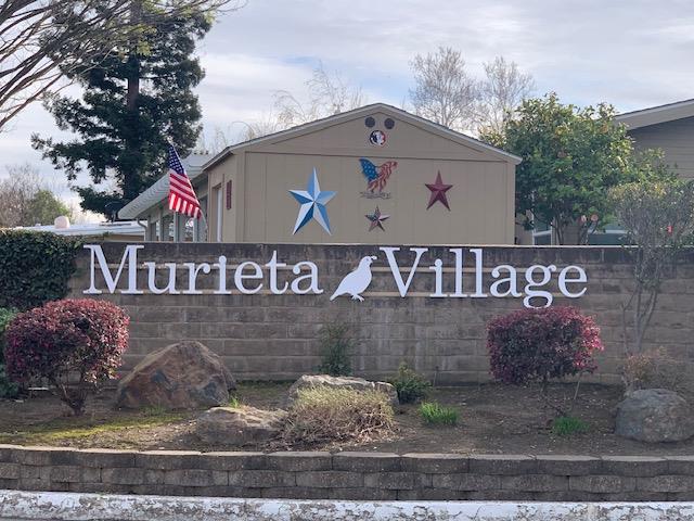 14789 Jurata Court Rancho Murieta, CA 95683 - Photo 35 of 36 a front view of a house with a sign board