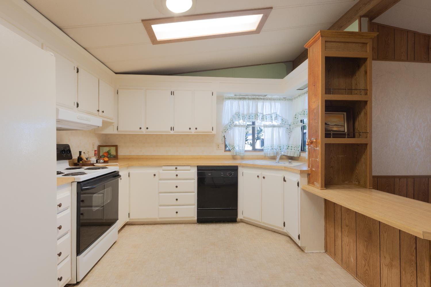 14789 Jurata Court Rancho Murieta, CA 95683 - Photo 6 of 36 a kitchen with white cabinets and appliances