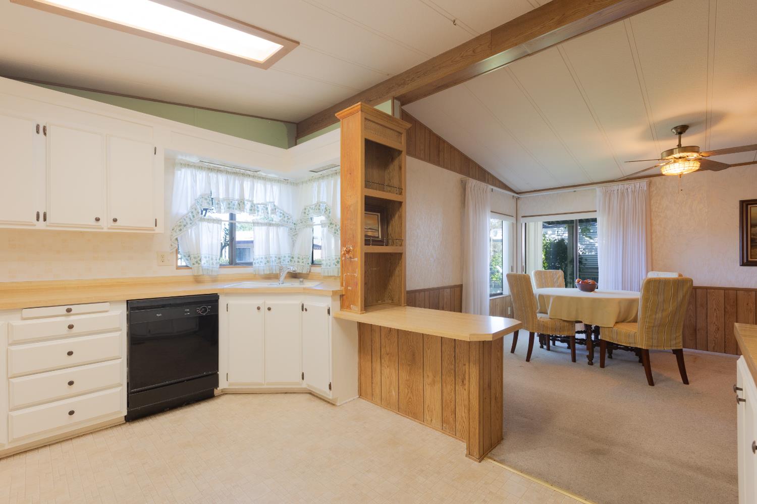 14789 Jurata Court Rancho Murieta, CA 95683 - Photo 8 of 36 a kitchen with cabinets and wooden floor