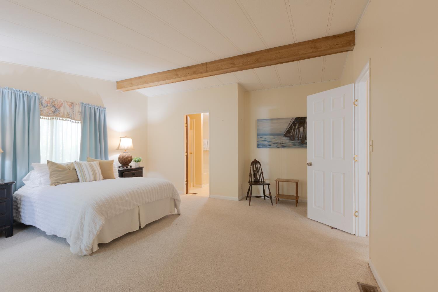 14789 Jurata Court Rancho Murieta, CA 95683 - Photo 10 of 36 a bedroom with a bed and a couch