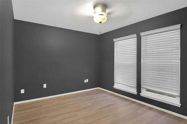 wooden floor and window in an empty room