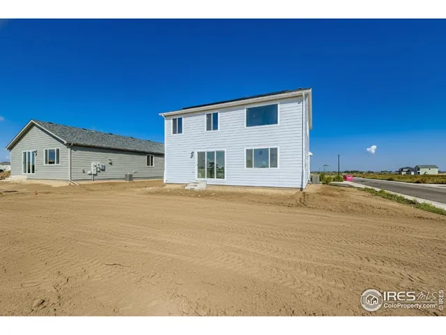 a house with trees in the background