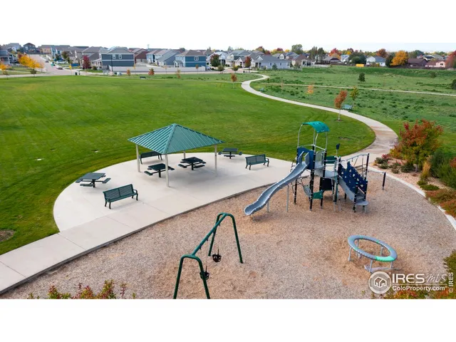 a view of a backyard with table and chairs