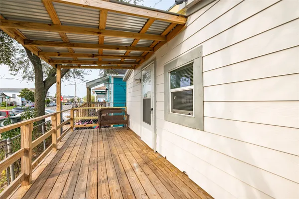 a view of a porch with wooden floor