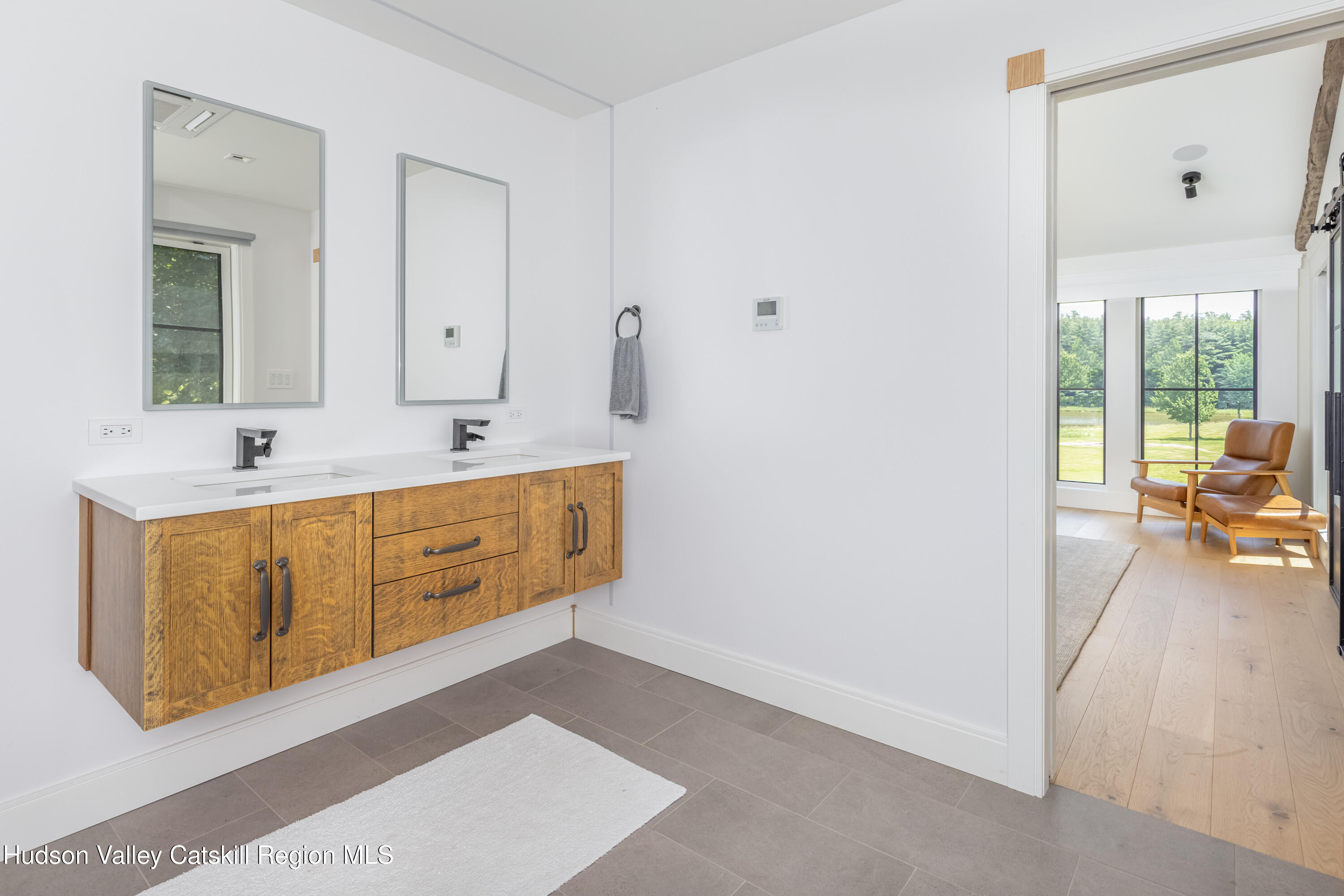 688 Bruce Porn Road Gilboa, NY 12167 - Photo 67 of 104 a spacious bathroom with a sink mirror and vanity