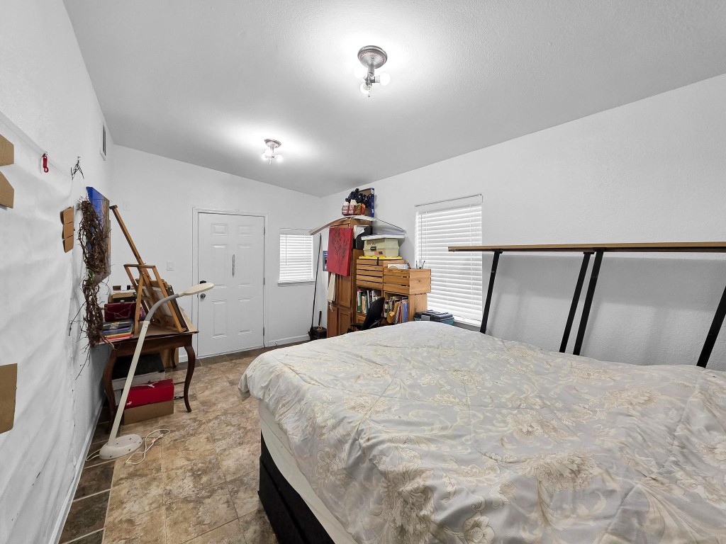 1771 Wilpitz Road Brookshire, TX 77423 - Photo 33 of 50 a bed room with a bed and a ceiling fan