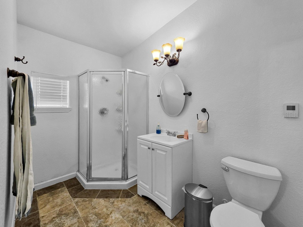 1771 Wilpitz Road Brookshire, TX 77423 - Photo 34 of 50 a bathroom with a toilet a sink and mirror