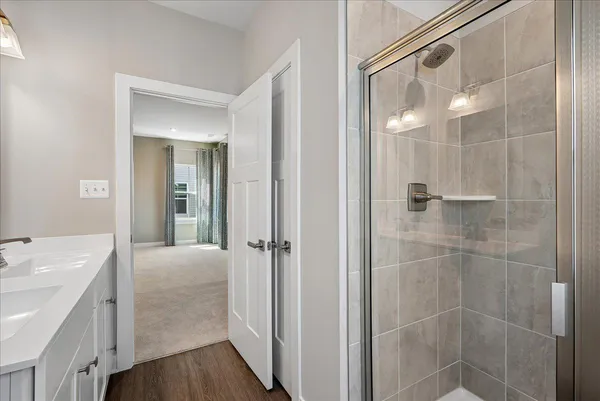 a bathroom with a sink toilet and shower