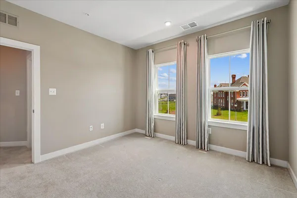 an empty room with windows