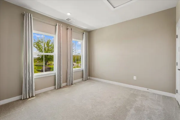 an empty room with closet area