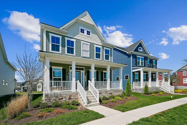 a view of a house with a yard porch and sitting area