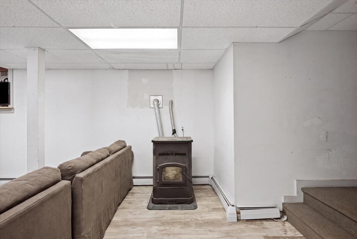 238 Bowdoinham Road Sabattus, ME 04280 - Photo 5 of 60 Pellet stove, family room