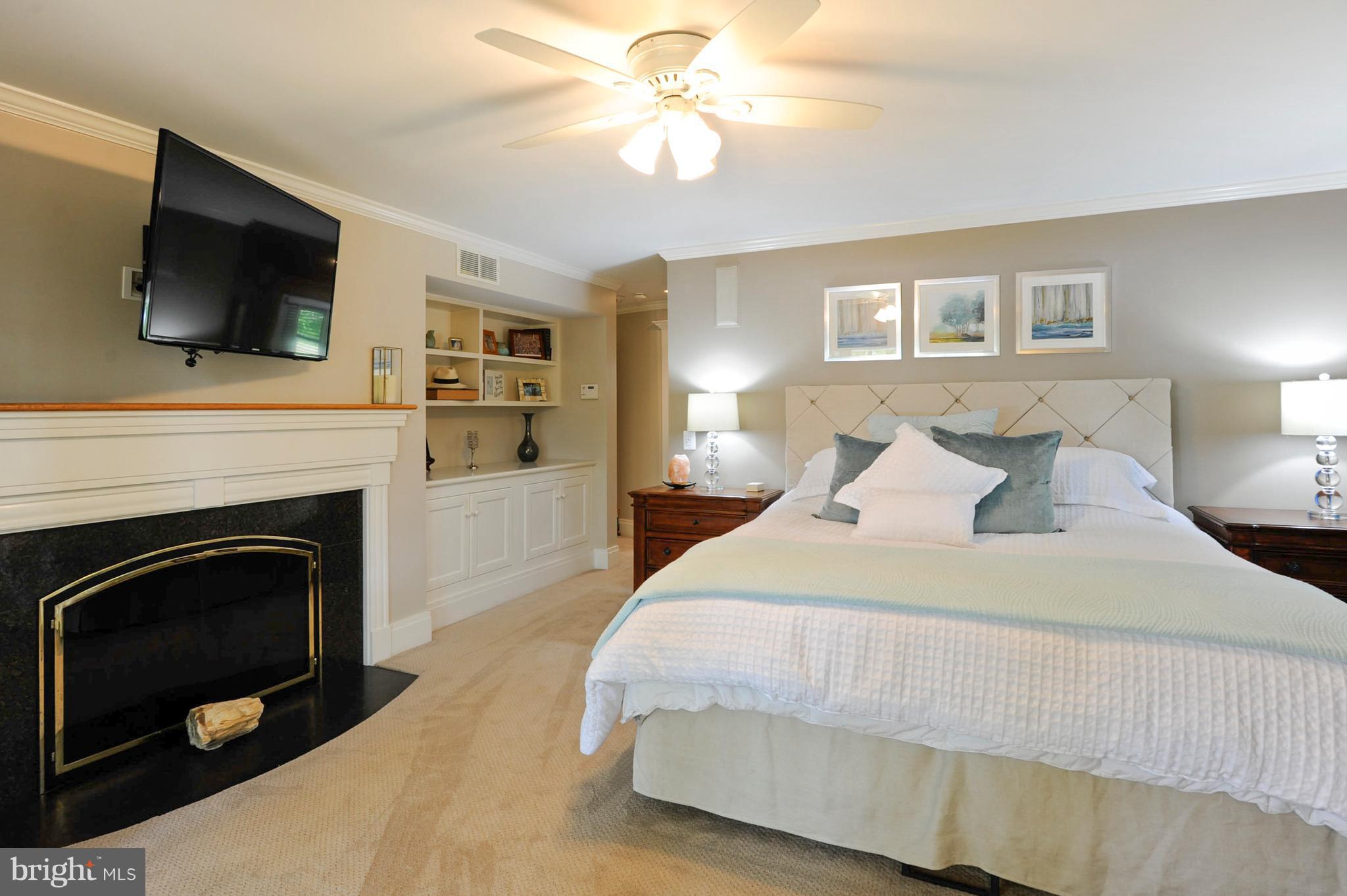 700 Seagull Beach Road Prince Frederick, MD 20678 - Photo 12 of 30 a spacious bedroom with a bed and a flat screen tv