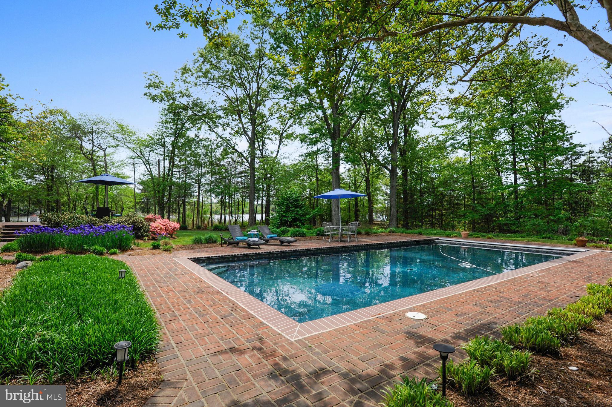 700 Seagull Beach Road Prince Frederick, MD 20678 - Photo 16 of 30 a view of a swimming pool with a patio