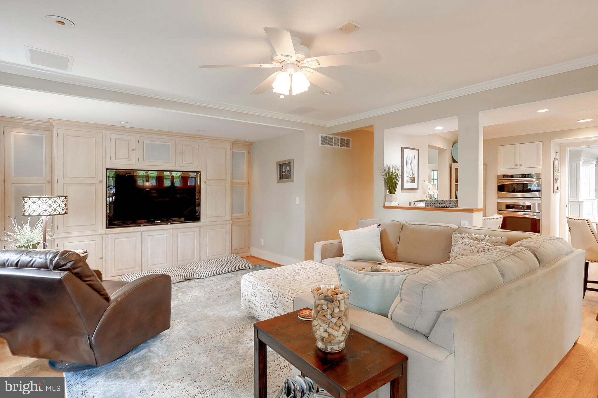 700 Seagull Beach Road Prince Frederick, MD 20678 - Photo 19 of 30 a living room with furniture and a flat screen tv
